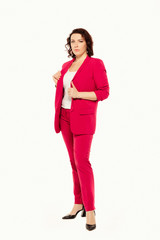 Wall Mural - Full length of confident, serious young business woman in red suit, isolated on white background