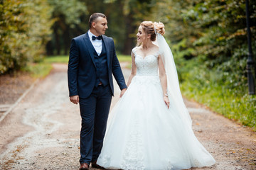 Wedding wedding day beautiful bride and elegant groom walking after wedding luxury