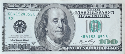 Fotomural Portrait of US president Benjamin Franklin on 100 dollars banknote closeup macro fragment