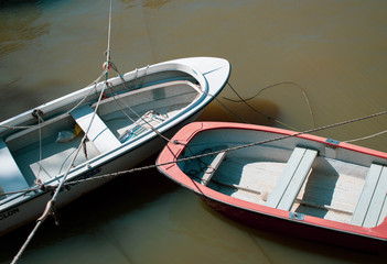 Two boats moored in the river