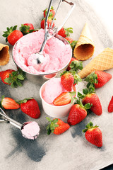 Wall Mural - Strawberry ice cream scoop with fresh strawberries and waffle icecream cones on stone background