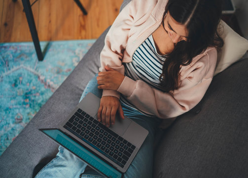 Top view of young female freelancer in digital marketing working remotely using laptop device typing text message, People Technology Project New Startup, Woman having video call via laptop computer