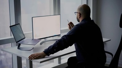 Wall Mural - Caucasian male employee accounting crypto currency while networking banking website in corporate company, blank monitor of digital computer with copy space on desktop table 
