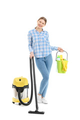 Poster - Young woman with vacuum cleaner and supplies on white background