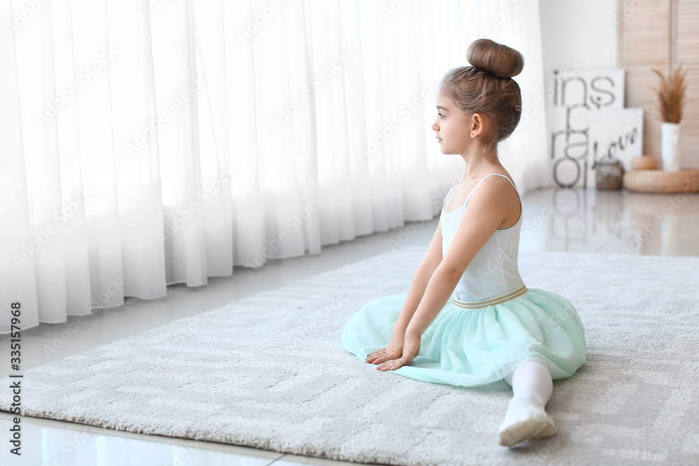 Cute little ballerina at home