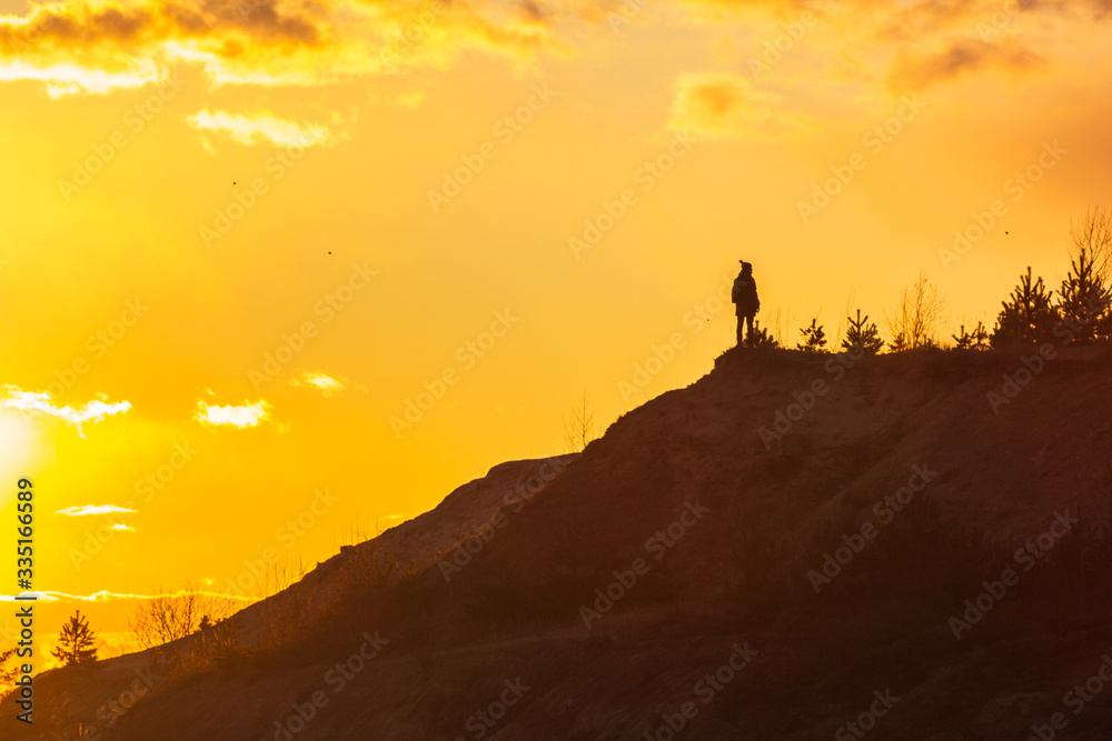 man at the top enjoying the sunset wanderlust happiness - obrazy, fototapety, plakaty 