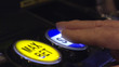 Pressing spin button on casino slot machine