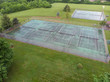 Group of tennis courts at park after summer rain