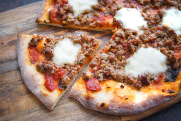 Homemade pizza, With mozzarella, tomatoes and meat, Dark background