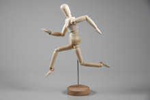 Wooden Mannequin On Gray Background