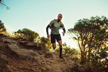 Man Running On A Rocky Mountain Trail