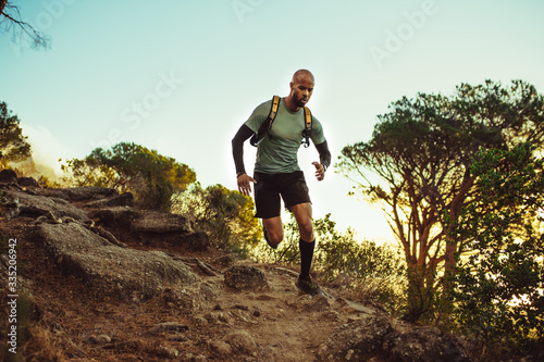 Fotografía Man running on a rocky mountain trail