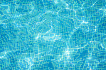 Clean blue water in swimming pool