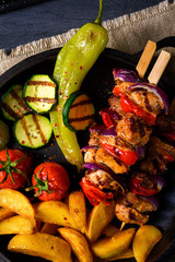 Wall Mural - Shish kebab with various vegetables and spice country potatoes