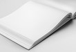 © olegphotor - Mockup of a white blank page of an open landscape orientation book, with realistic shadows, for design presentation.