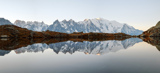 picturesque panorama of chesery lake (lac de cheserys) and snowy monte bianco mountains range on bac