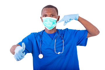 Poster - young male doctor pointing finger on medical mask and showing hi