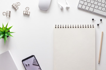 Wall Mural - Home office desk with empty copy space and sketchbook mockup. Office supplies.