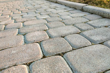 Close-up Of Slab Stone Paved Path Way At Park Or Backyard. Walkway Footpath Road At House Yard Garden.