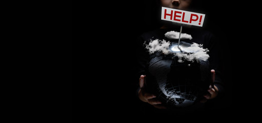 Wall Mural - our planet under heavy clouds need help sign on black background