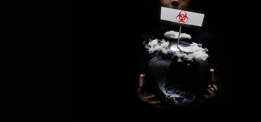 Wall Mural - our planet under heavy clouds on black horizontal background