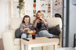 © DC Studio - Mother and daughter in living room