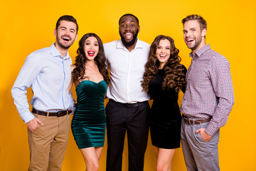 Wall Mural - Photo of gorgeous two fancy ladies three macho guys company students graduation party well-dressed cheerful best friends hugging buddies good mood isolated yellow color background