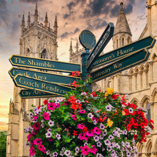 The York Minster And A Sign With Directions To Landmarks In The City