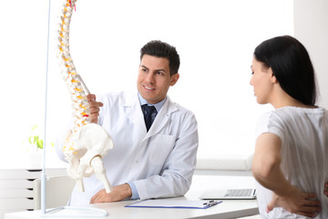 Poster - Young woman visiting orthopedist in medical office