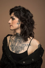 Profile Portrait Of Confident Transgender Woman With Chest Tattoo