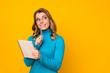 © deagreez - Photo of attractive business lady curly hairdo hold paper personal planner writing new novel chapter inspired look up wear specs blue turtleneck isolated bright yellow color background