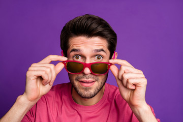 Sticker - Closeup photo of attractive guy taking off sun specs watch see crazy cool offer low shopping prices season opening wear casual pink t-shirt isolated purple color background