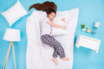 Sticker - Full body high angle above flat lay view photo of overjoyed charming lady lying floor hug pillow blanket comfy bedroom eyes closed wear t-shirt pants pajama isolated blue color background