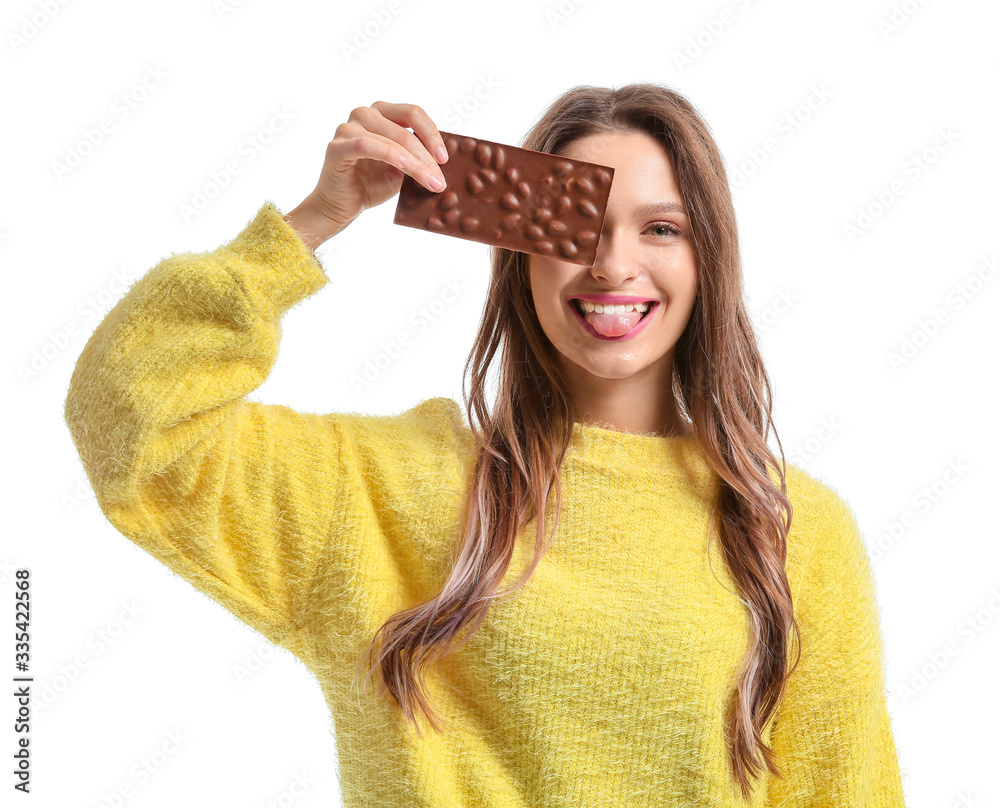 Beautiful young woman with chocolate on white background