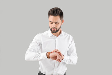 Sticker - Handsome businessman with healthy hair on light background