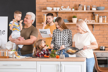 Wall Mural - Big family cooking together in kitchen