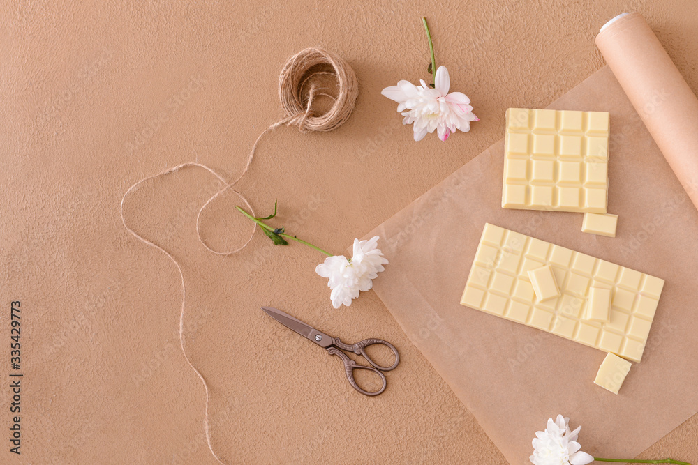 Composition with sweet white chocolate on table