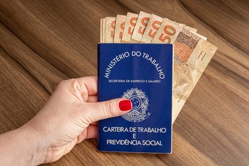 Brazilian document work and social security ( Carteira de Trabalho e Previdencia Social) with brazilian money