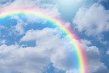 Wall Mural - rainbow in blue sky.