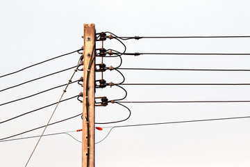 Electric poles and electrical cables are connected to the consumer,
On a white isolated background.