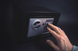 Cash Money Safe Deposit. Symbol of money safety. Man open small Residential Vault. Toned soft focus picture.