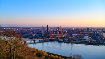 Wall Mural - view from mountain pfenningberg near steyregg to the city of linz with steel and chemical industry, upper austria