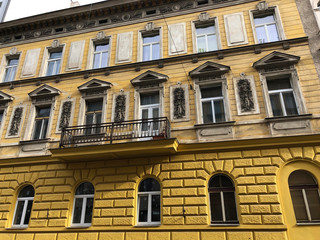 Wall Mural - Yellow building facade in romanesque style