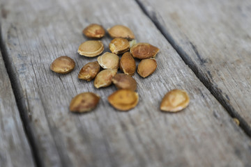 Wall Mural - Almonds seeds on wooden background