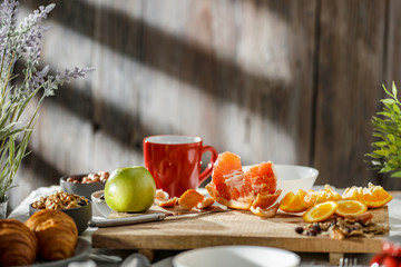 Sticker - Breakfast on the table on a beautiful holiday morning with free space for an advertising product