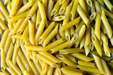 A bunch of yellow macaroni close up