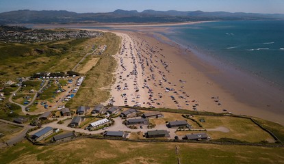 Wall Mural - Aerial view of Black Rock Sand Beach and Snowdonia Mountains, Morfa Bychan, Porthmadog, Wales, UK