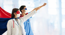 Doctor Or Nurse In Face Mask And Superhero Cape.
