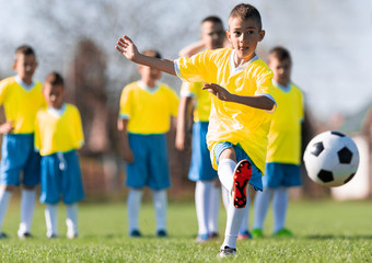 Wall Mural - Boys play soccer sports field