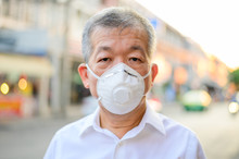 Pandemic Coronavirus Old Man In City Street Wearing Face Mask Protective For Spreading